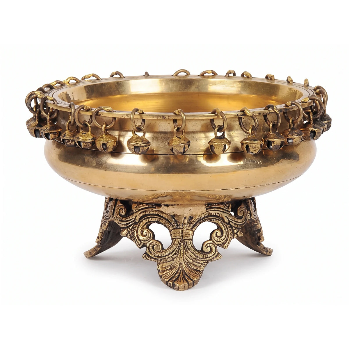 Carillon Urli, a brass urli with small bells around the rim, on a carved three-footed stand