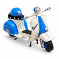 Corso Scooter, a blue and cream miniature scooter with a helmet on the seat, front view