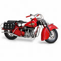 Roadster Motorcycle, a red miniature motorcycle with black saddlebags, side view