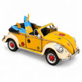 Surfside Convertible, a yellow miniature convertible with flower decals and surfboards, front right view
