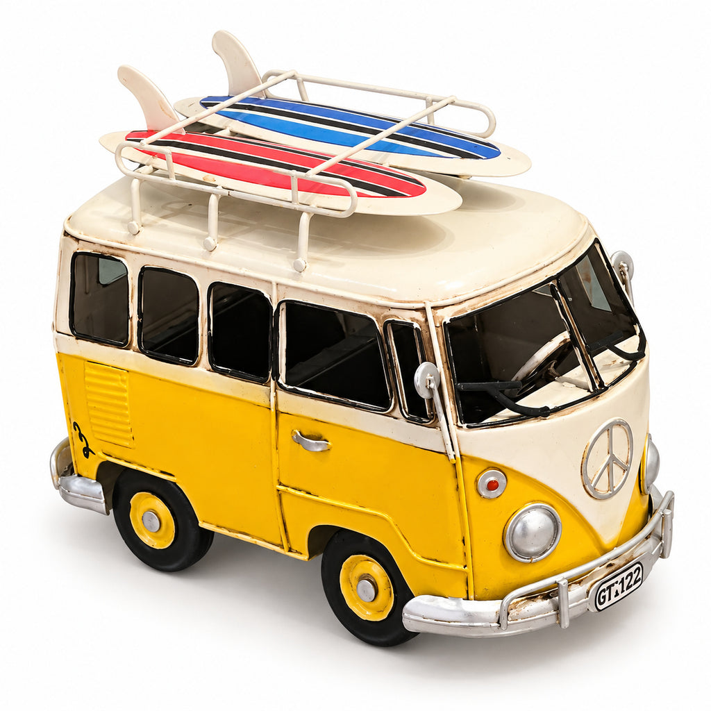 Wayfarer Van, a yellow and cream miniature camper van with surfboards on the roof, front right view